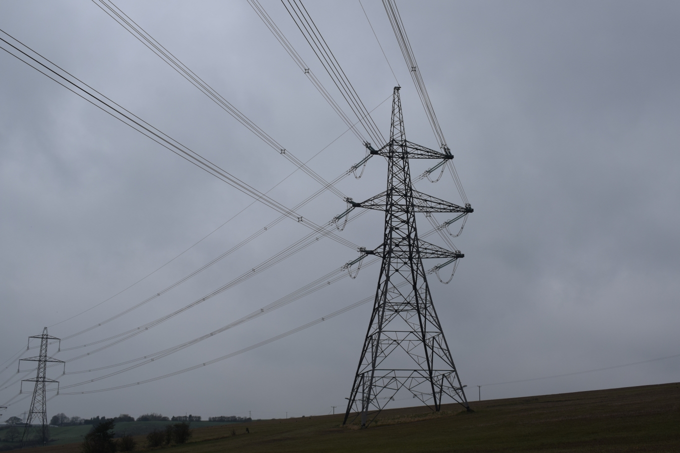 Overhead transmission line in a field 